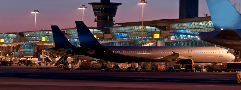 A large airplane is parked at an airport.