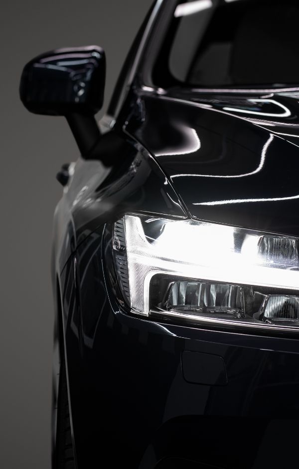 A close up of the front lights on a car