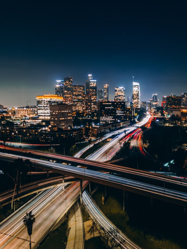 A city skyline with many lights and traffic.